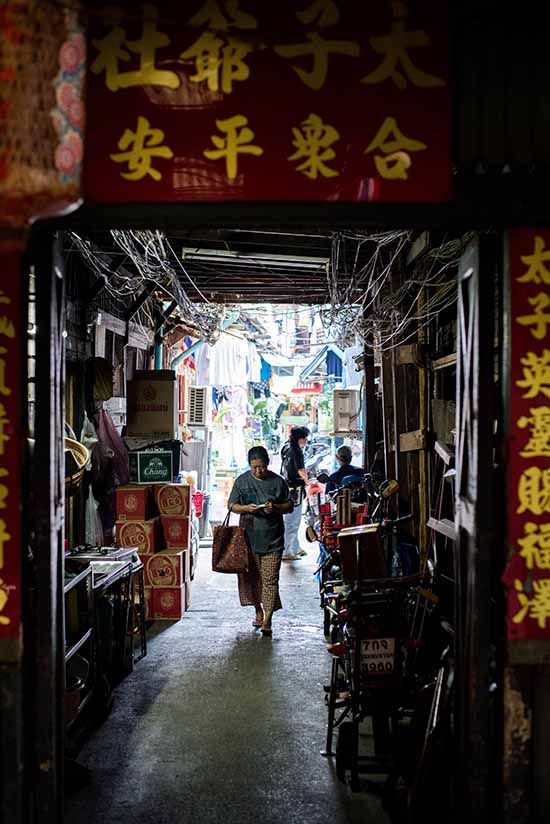 Woman walking in a Chinese alleys