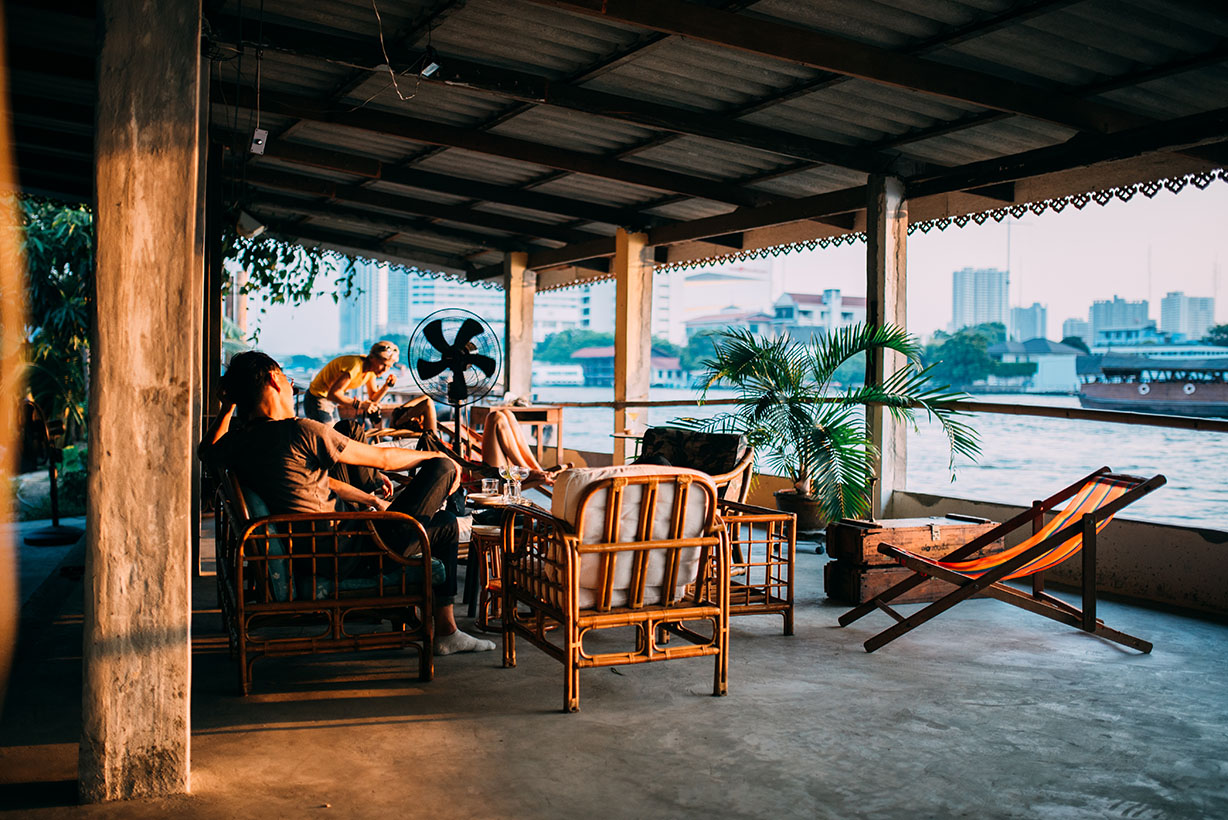 People chilling by the river in Bangkok