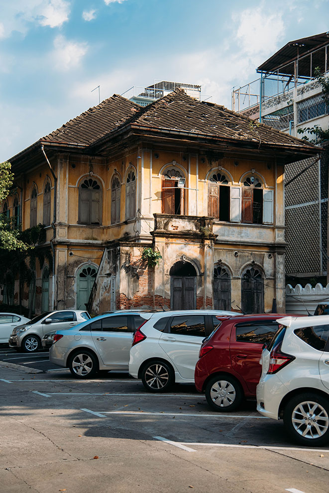 parking lot in Bangkok with old building